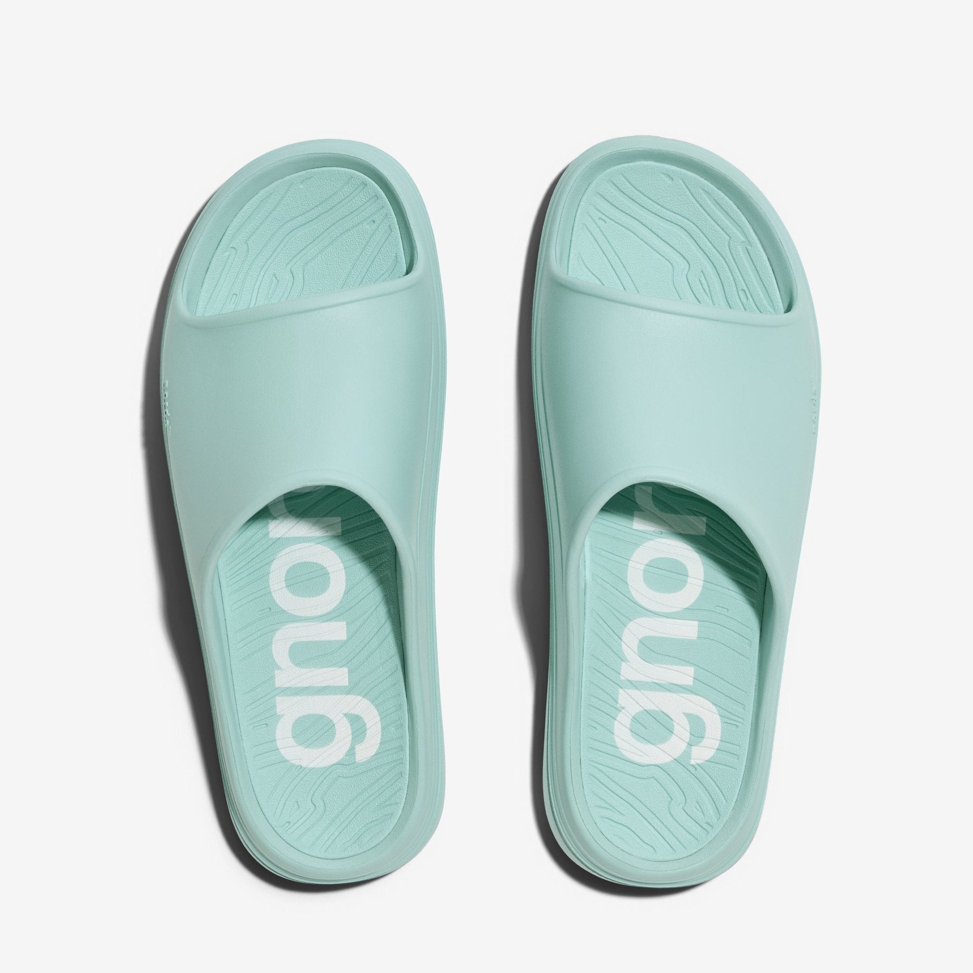The norda 008 recovery slide supports your feet post-run with arch support, soft foam, and a grippy Vibram® ECOSTEP sole.