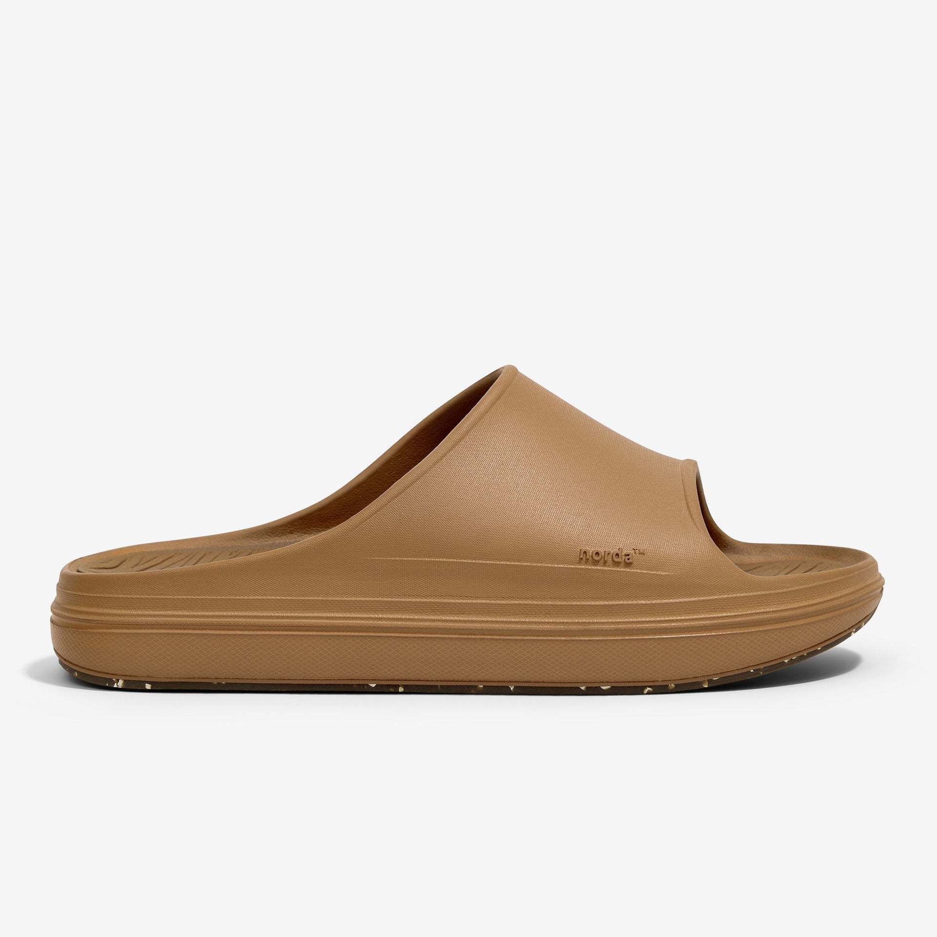The norda™ 008 recovery slide supports your feet post-run with arch support, soft foam, and a grippy Vibram® ECOSTEP sole.