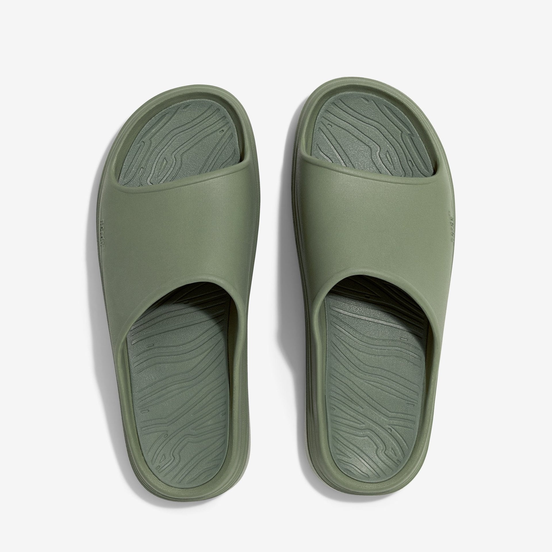 The norda™ 008 recovery slide supports your feet post-run with arch support, soft foam, and a grippy Vibram® ECOSTEP sole.
